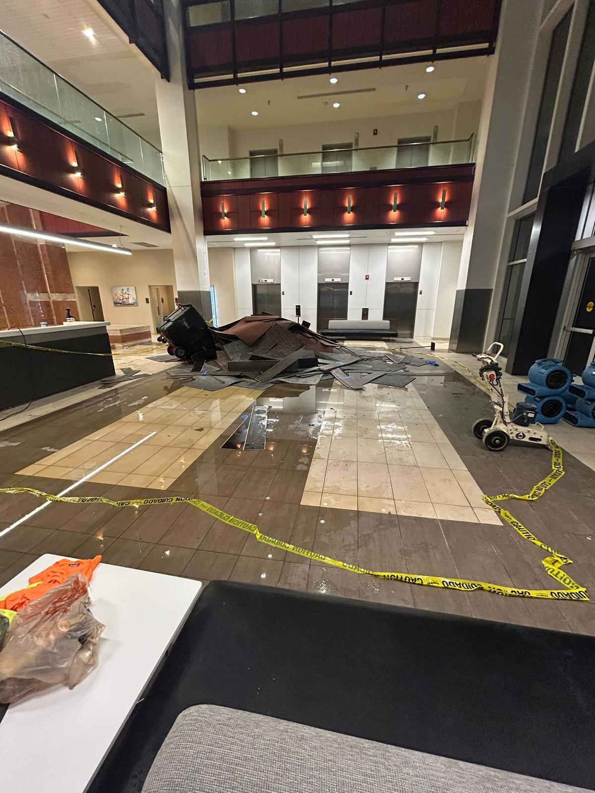 Lobby with caution tape during restoration