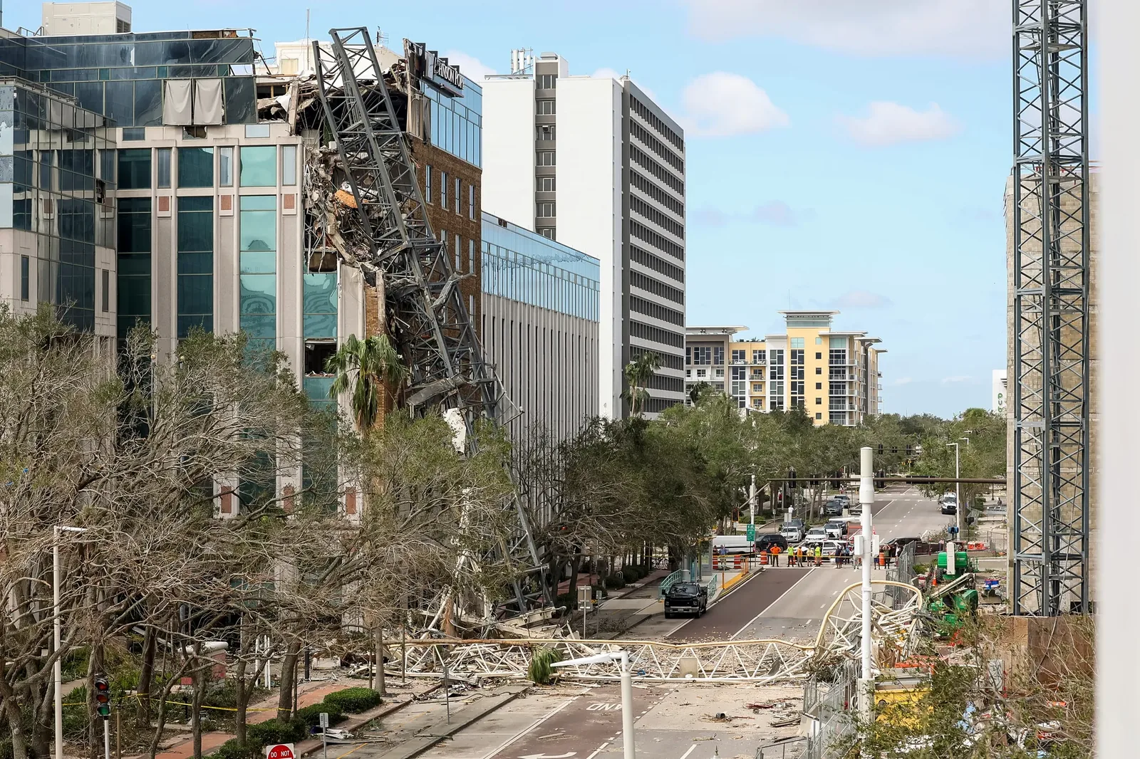 Construction crane impact on commercial building during Hurricane Milton