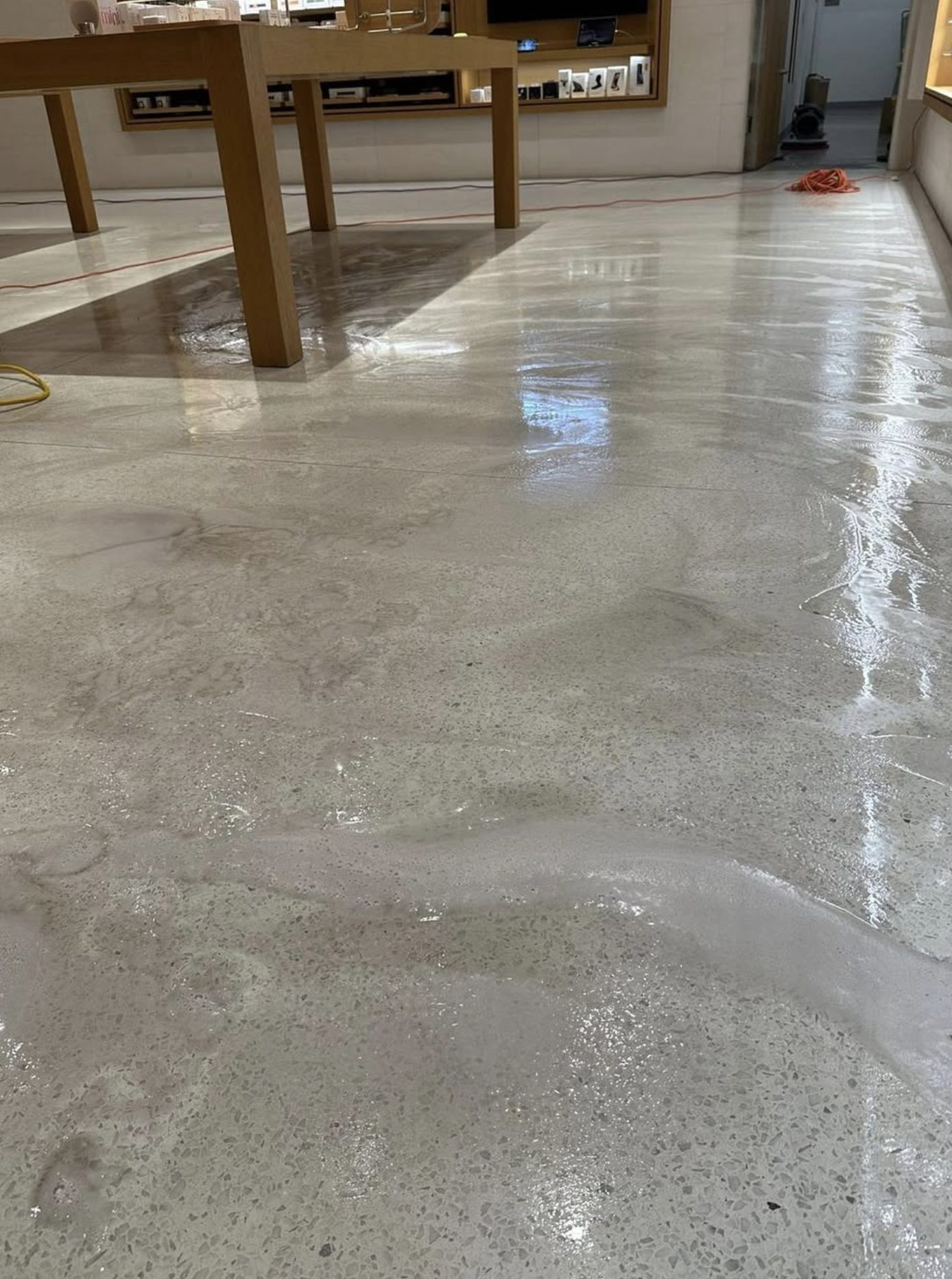 BlueSky crew stripping floor at Apple retail store
