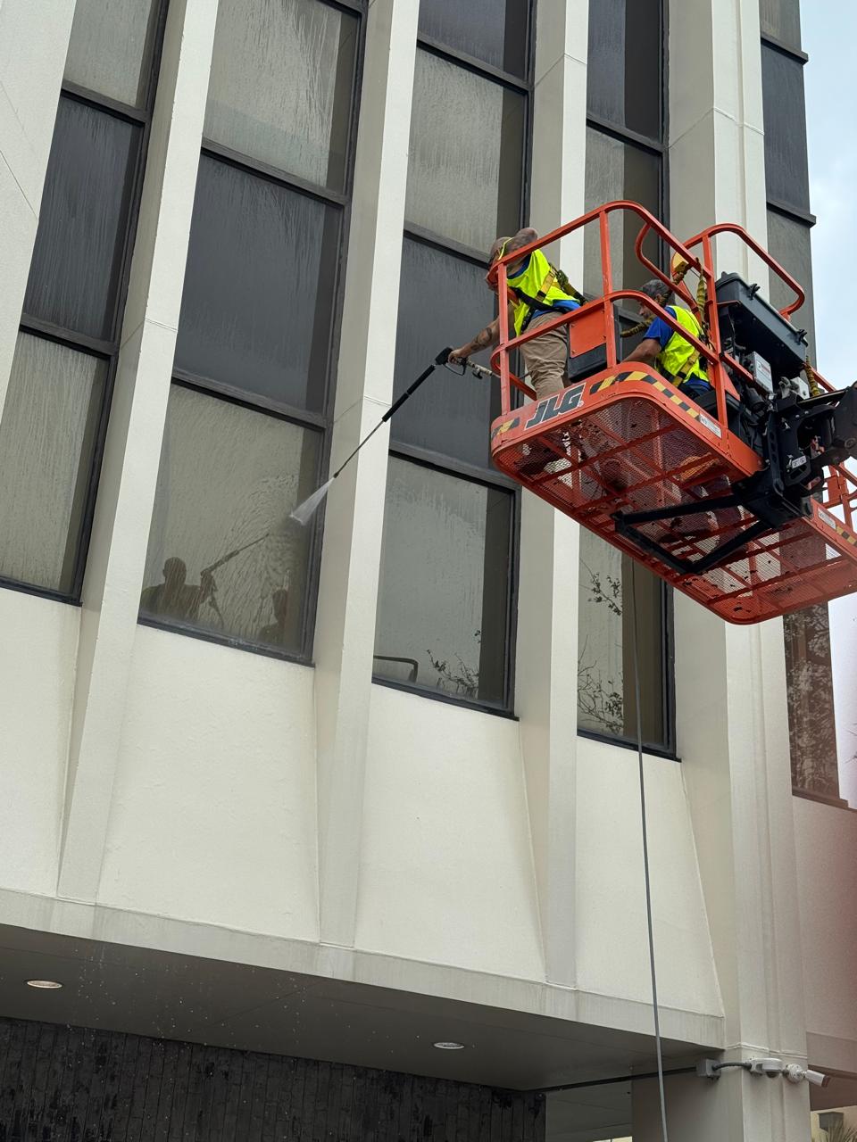 Boom lift window cleaning on a commercial building